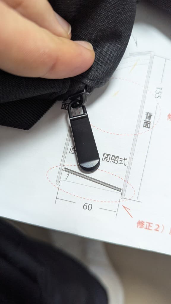 Specification check on custom handbags during an on-site compliance review.